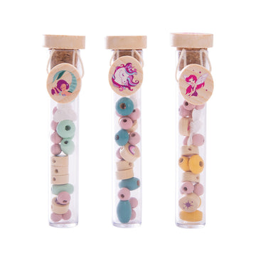 Three test tube filled with coloured wooden beads.