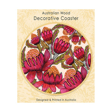 A round wooden coaster printed with waratah flowers attached to a packaging card.