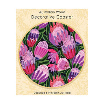 Decorative wooden coaster with floral design attached to a packaging card.