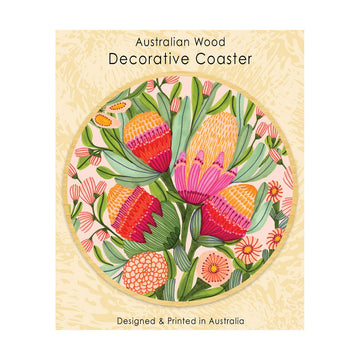 A round wooden coaster printed with protea flowers attached to a packaging card.