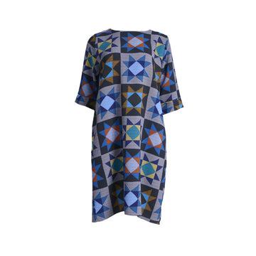 A dress in grey printed with a star pattern.