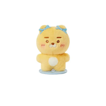 Yellow plush toy with blue bows on a white background.