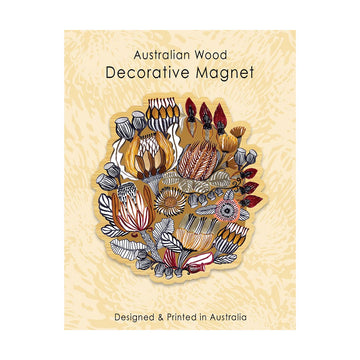 Decorative magnet with Australian wood floral design on a beige background.