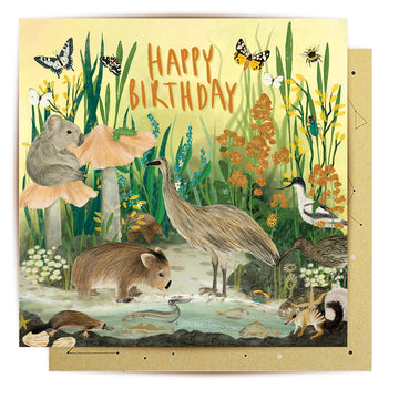 Birthday card with nature-themed illustration of animals and flowers.