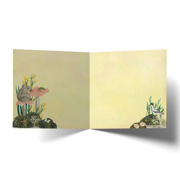Birthday card with nature-themed illustration of animals and flowers.