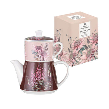 Teapot and mug stacking set with floral design next to packaging box on a white background.