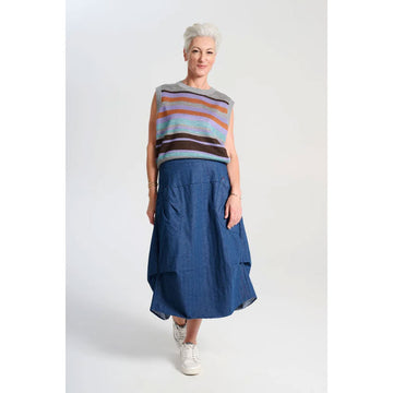A light denim skirt with side pockets and side tucks.