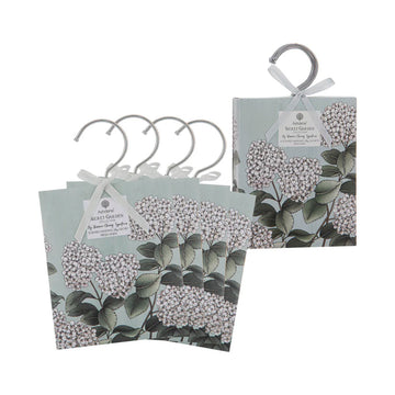 Set of four floral-patterned hangers with packaging on a white background.