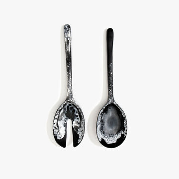 A pair of salad servers in black marble resin.