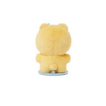 Yellow plush toy with blue bows on a white background.