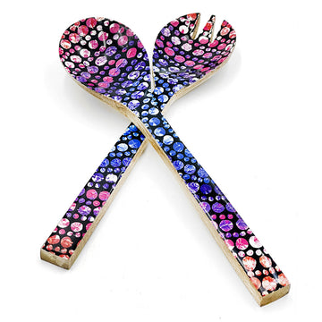 A pair of wooden salad servers printed with artwork by Olivia Wilson on the front.