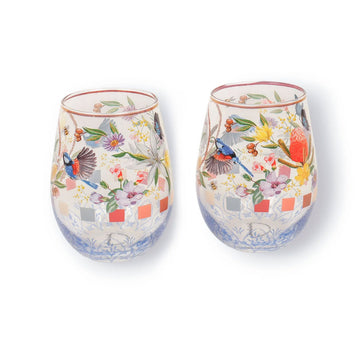 Two stemless wine glasses with animal and floral designs with a decorative box on a white background.