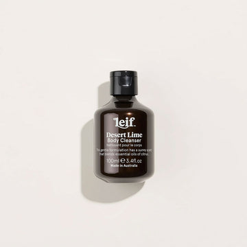 A small brown bottle with a black lid and white text on the front titled 'Desert Lime Body Cleanser'.