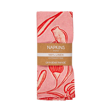 Pack of pink napkins with red patterns and a visible brand label on a white background.