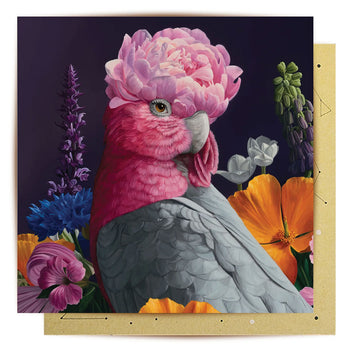 A square greeting card with an illustration of a galah surrounded by flowers.