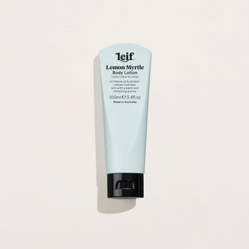 A light blue tube of hand cream with a black lid and text titled 'Lemon Myrtle Body Lotion'.