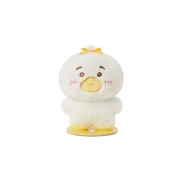 Cartoon duck plushie with a yellow bow on a white background.