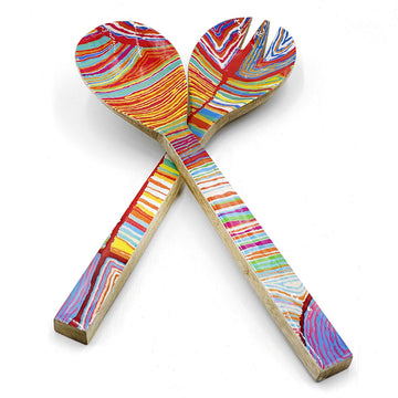 A pair of wooden salad servers printed with artwork by Judy Watson on the front.
