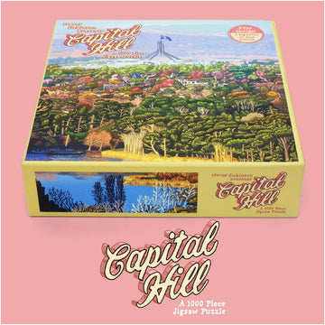 A puzzle box title 'Capital Hill' with an illustration of Parliament House and greenery by Trevor Dickinson.