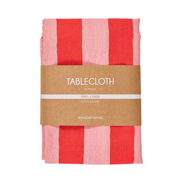 Red and pink striped tablecloth with a brown label on a white background.