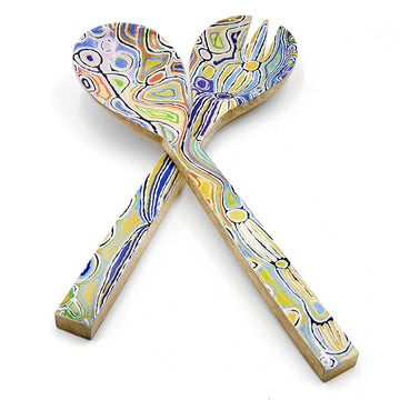 A pair of wooden salad servers printed with artwork by Judy Watson on the front.