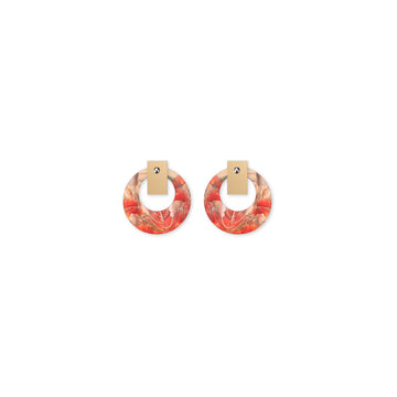 Pair of earrings with floral design on a white background.