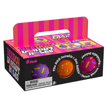 A box with a handle and circle cut outs showing ball shaped squish toys inside. The box has the heading 'NeeDoh Donut Holes'.