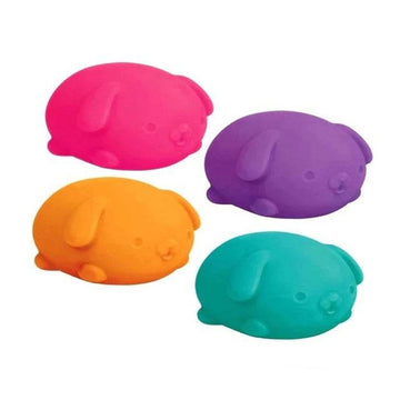 A dog shaped squish toy inside a black box with cut outs and the heading 'Nee Doh Funky Pup'.
