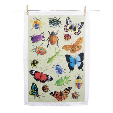 A tea towel illustrated with bugs is hanging off a wire with pegs.