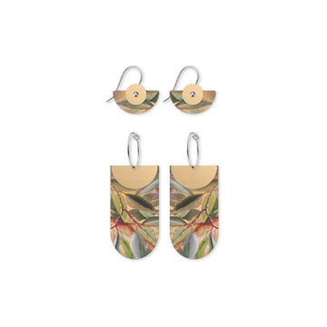 Two pairs of earrings with leaf pattern on a white background