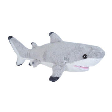 A grey shark soft toy with black tips on its fins.