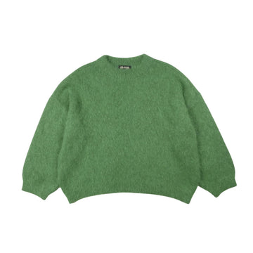 Green sweater on a white background.