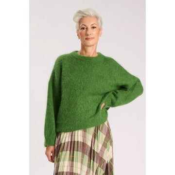 Green sweater on a white background.
