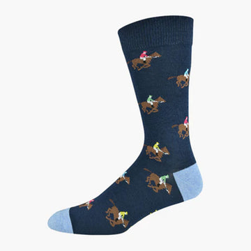 A navy sock with a light blue heel and toe and illustrated with jockeys riding horses.