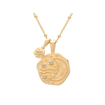 A gold pendant in a hexagon shape with an outline of a crescent moon on a gold chain.
