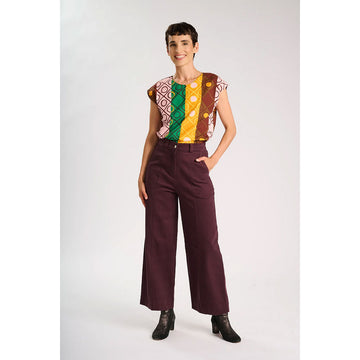 A pair of burgundy coloured pants.