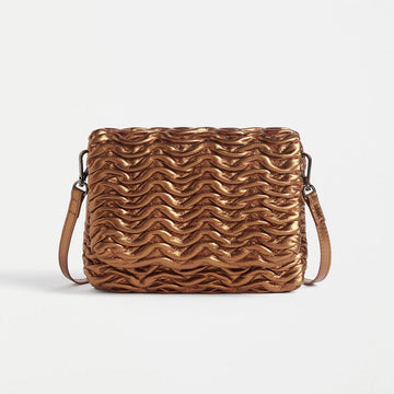 Front view of a rectangle cross body bag with an embossed wave pattern across the bag.