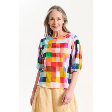 A women's blouse with a colourful checkered print.