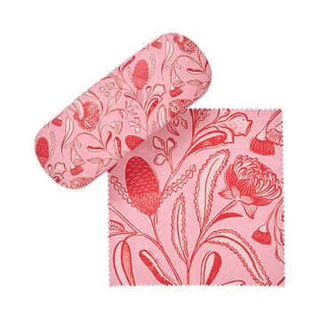 Pink floral patterned glasses case and lens cloth on a white background.