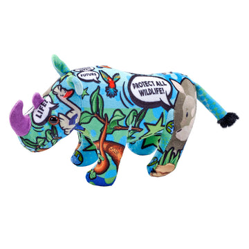 A rhino soft toy in blue with a multicoloured print of trees and speech bubbles.
