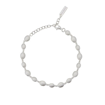 A silver bracelet with shells linked together.