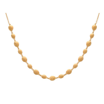 A gold necklace made of shells linked together.