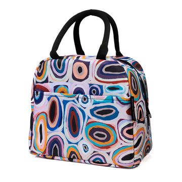 An insulated lunch bag printed with artwork by Gladys Kuru Bidu with black handles.