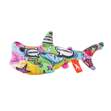 A multicoloured shark soft toy printed with speech bubbles and stars.