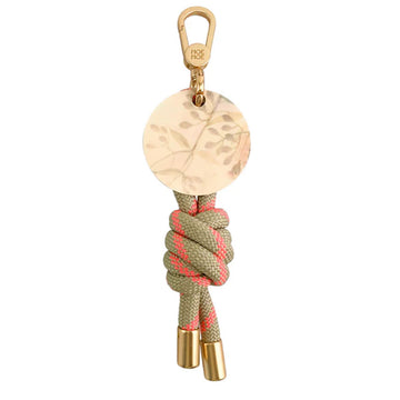 Keychain with floral and rope design on a white background.