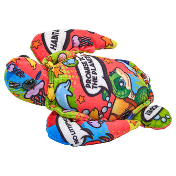 A multicoloured turtle soft toy printed with sea animals and speech bubbles.