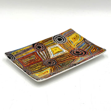 A rectangle ceramic tray printed with artwork by Mary Napangardi Brown in shades of brown and yellow.