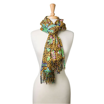 A mannequin is wearing a yellow and black scarf printed with artwork by Rosemary Turner.