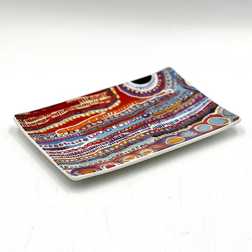 A ceramic rectangle tray printed with artwork by Murdie Morris.