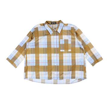 Plaid shirt in yellow and blue on a white background.
